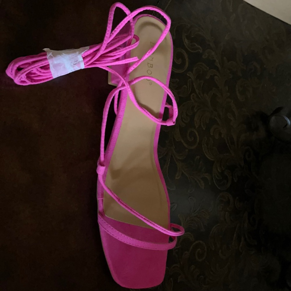 Hot pink sandals tie up the leg